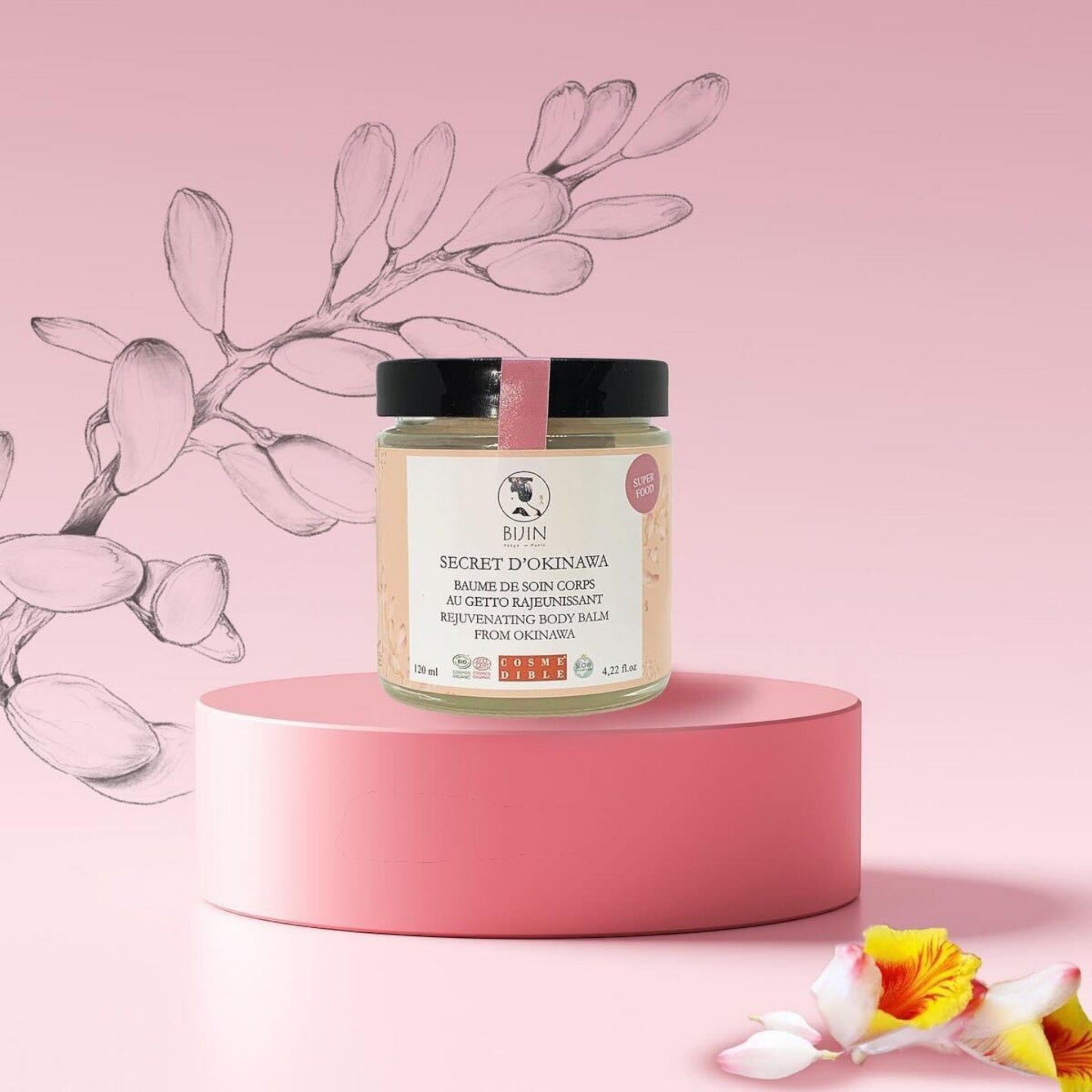 Nõma SkinCare Secret d’Okinawa Rejuvenating Body Balm in a glass jar, with a rich texture and silky finish.