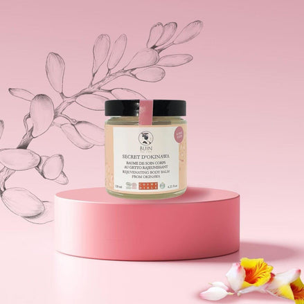 Nõma SkinCare Secret d’Okinawa Rejuvenating Body Balm in a glass jar, with a rich texture and silky finish.